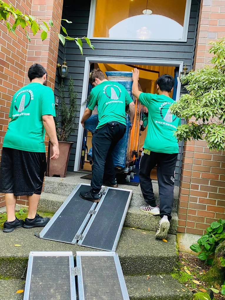 A Perfect Mover crew loading a moving truck using a ramp