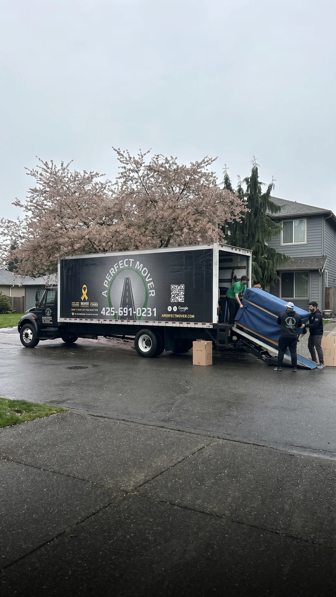 A Perfect Mover truck and crew prepared for a residential move