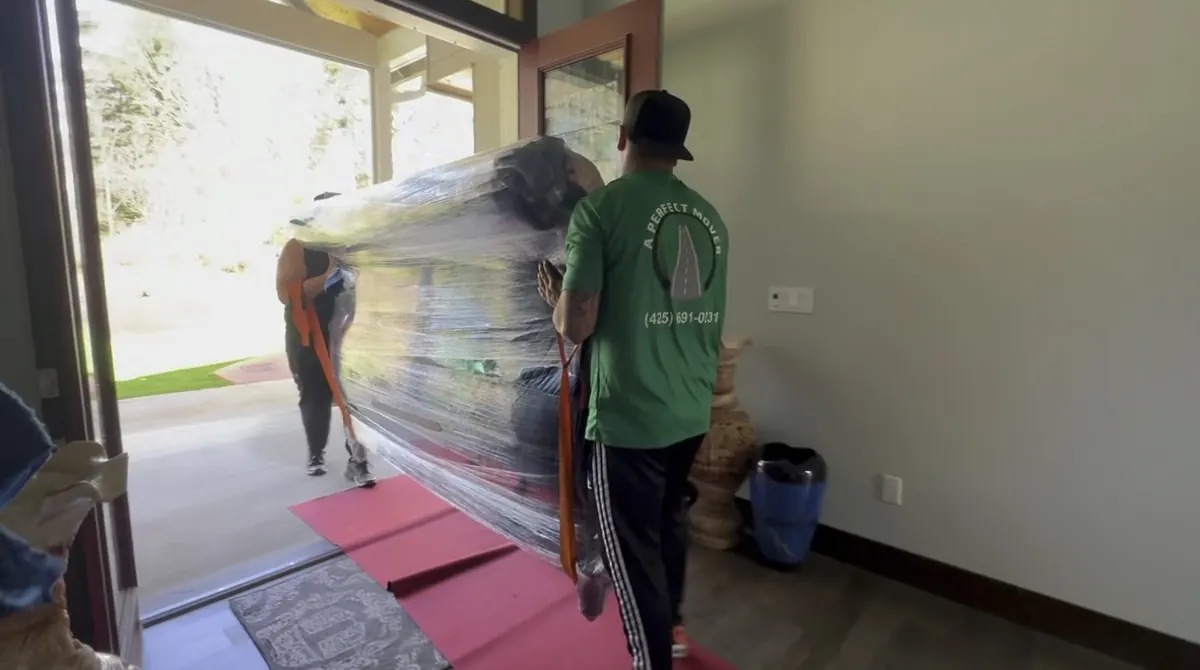 A Perfect Mover crew loading furniture into a moving truck during a local move